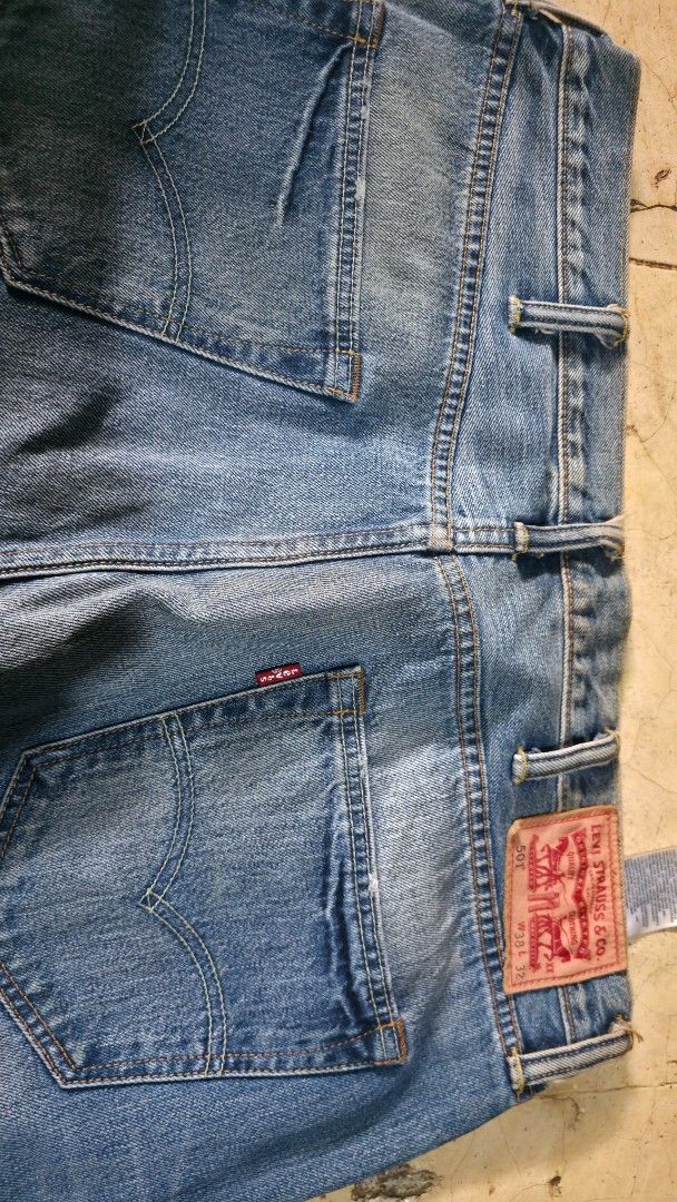 Levi's 501 Original Fit Jeans (Category: Jeans) located in Mandaluyong City. Submitted by jvc_9696 (Listing ID 1457006432, Image 3). Description: - Classic Levi's 501 jeans - Original fit, straight leg - Medium blue wash with natural fading - Authentic button fly closure - Iconic red tab detail - Versatile staple for any outfit - Honest issue, needs wash, nakatabi lang po kasi - Preloved not ukay .