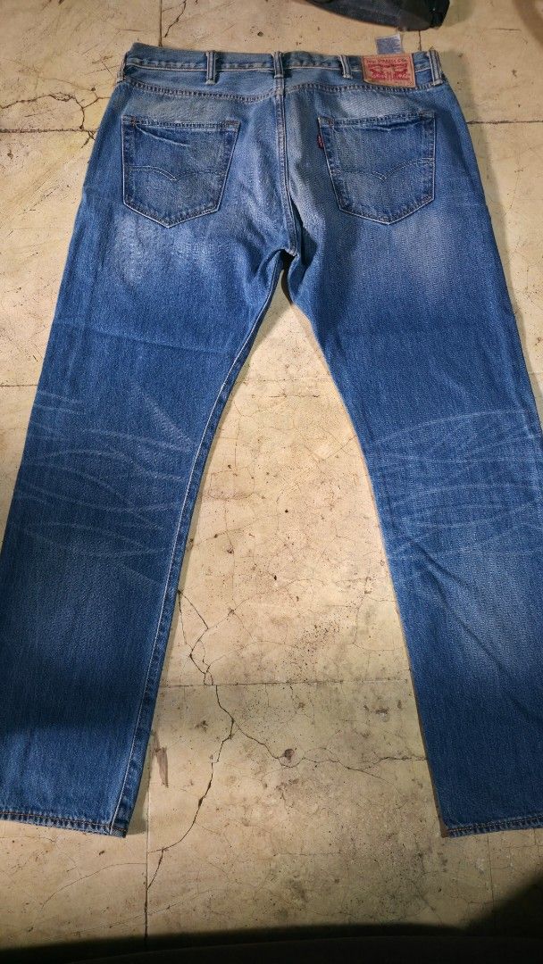 Levi's 501 Original Fit Jeans (Category: Jeans) located in Mandaluyong City. Submitted by jvc_9696 (Listing ID 1457006432, Image 1). Description: - Classic Levi's 501 jeans - Original fit, straight leg - Medium blue wash with natural fading - Authentic button fly closure - Iconic red tab detail - Versatile staple for any outfit - Honest issue, needs wash, nakatabi lang po kasi - Preloved not ukay .