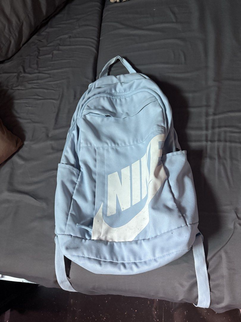 Light Blue Nike Backpack (Category: Backpacks) located in Pasay City. Submitted by mgyyyyyyyy (Listing ID 1457060431, Image 1). Description: - Light blue Nike backpack - Classic Nike logo on front - Front zip pocket - Side pockets - Adjustable straps - Ideal for school or everyday use - Note: Minor marks on the logo.
