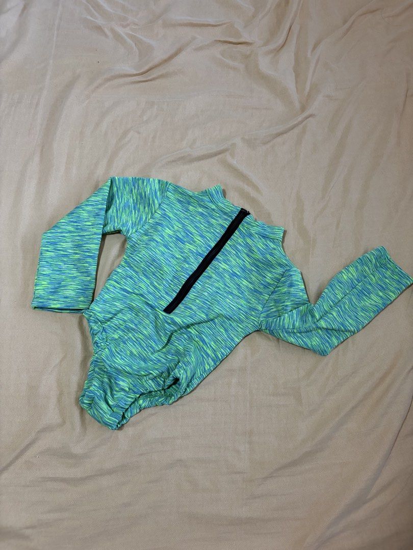 Long Sleeve Zip Up Rash Guard Swimsuit (Category: Rash guard) located in Paranaque City. Submitted by mayan_q (Listing ID 1457067466, Image 3). Description: Long sleeve rash guard with a zip-up front. The fabric has a marled green and blue pattern. It's stretchy and comfortable. Great for swimming or water sports. Keeps you protected from the sun. Easy to put on and take off with the zipper. RFS: De-cluttering and outgrown Child size is good for 