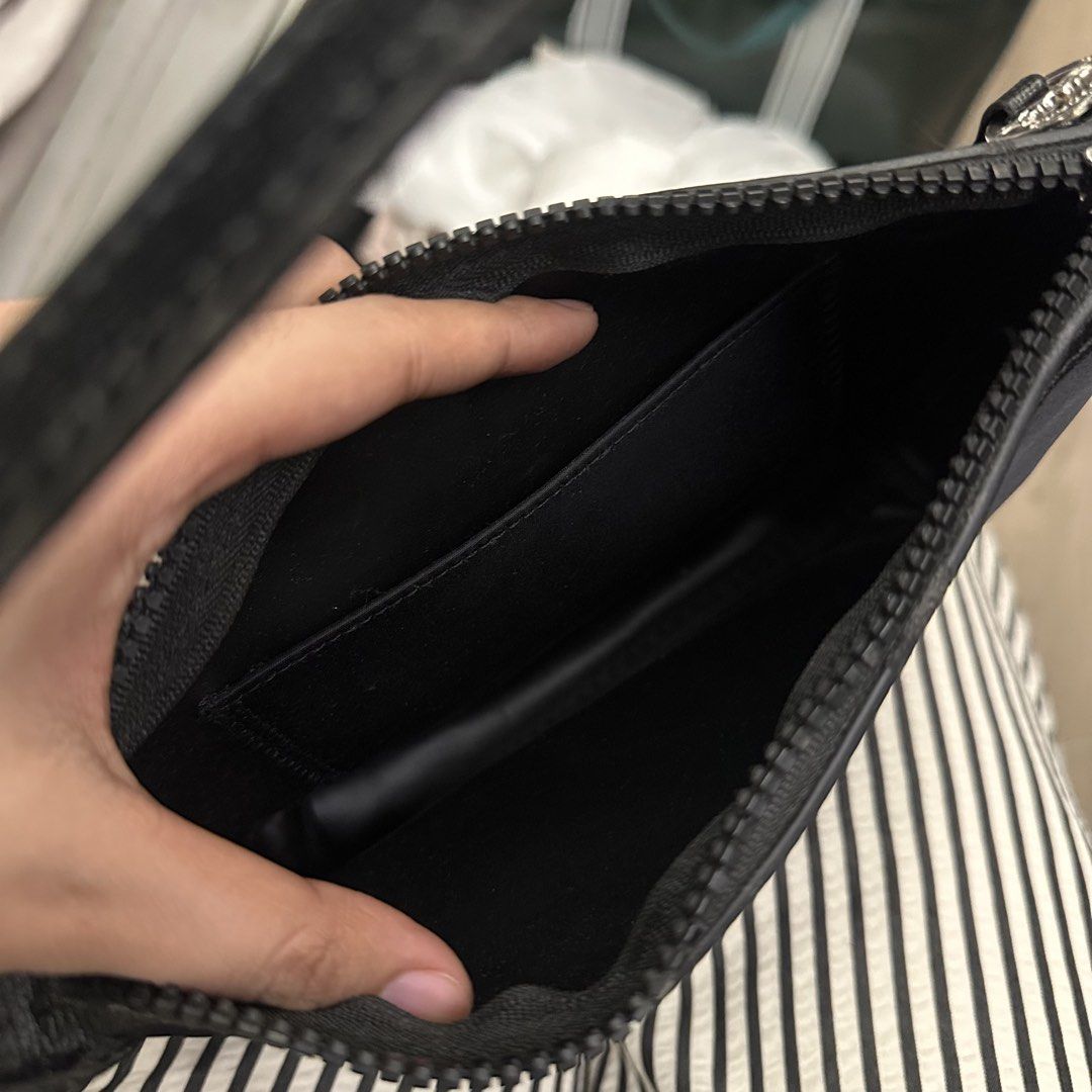 Longchamp Black Nylon Shoulder Bag (Category: Luxury Bags & Wallets) located in Manila. Submitted by mjoycie (Listing ID 1457093497, Image 3). Description: - Classic black shoulder bag by Longchamp - Made from durable nylon material - Secure zipper closure - Features an interior pocket - Comfortable strap for easy carrying - Ideal for everyday use or travel - Simple and chic design.