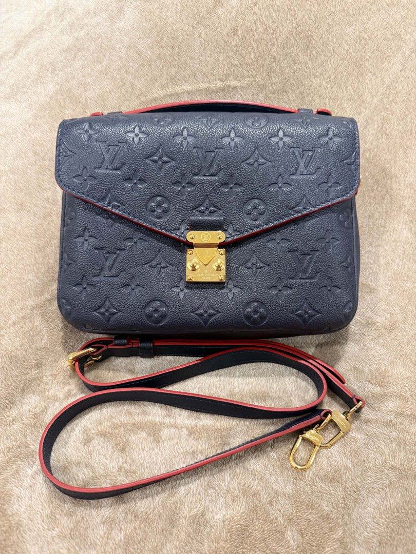 Louis Vuitton Monogram Empreinte Leather Shoulder Bag (Category: Luxury Bags & Wallets) located in Paranaque City. Submitted by lovedstuffby_ang (Listing ID 1456955320, Image 1). Description: Like New LV Monogram Empriente Navy Blue -Used a few times only -Complete inclusions -Store bought in Australia - Navy blue Louis Vuitton bag - Classic monogram empreinte pattern - Red trim detail - Top handle - Detachable shoulder strap - Gold hardware - Zi