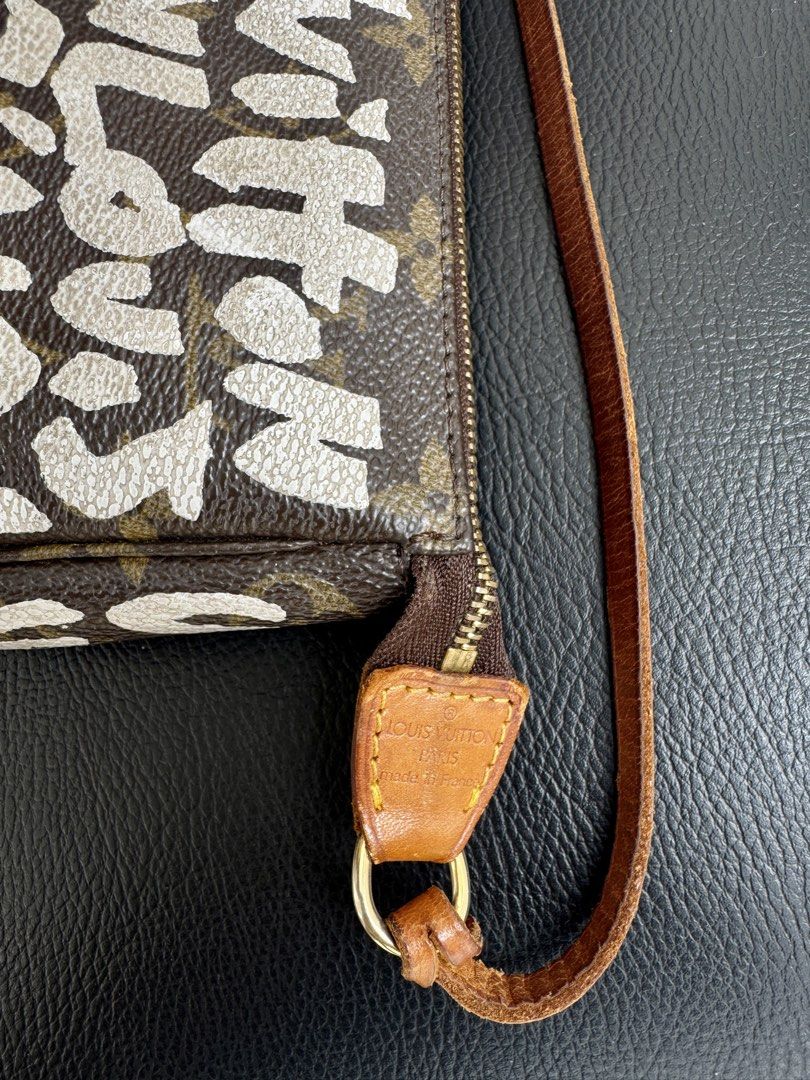Louis Vuitton Stephen Sprouse Graffiti Pochette (Category: Luxury Bags & Wallets) located in Manila. Submitted by anotherbagclub (Listing ID 1457130938, Image 2). Description: Authentic LV Pochette (Stephen Sprouse Graffiti edition) with dustbag Good vintage condition Sure buyers, DM for more photos ✨.