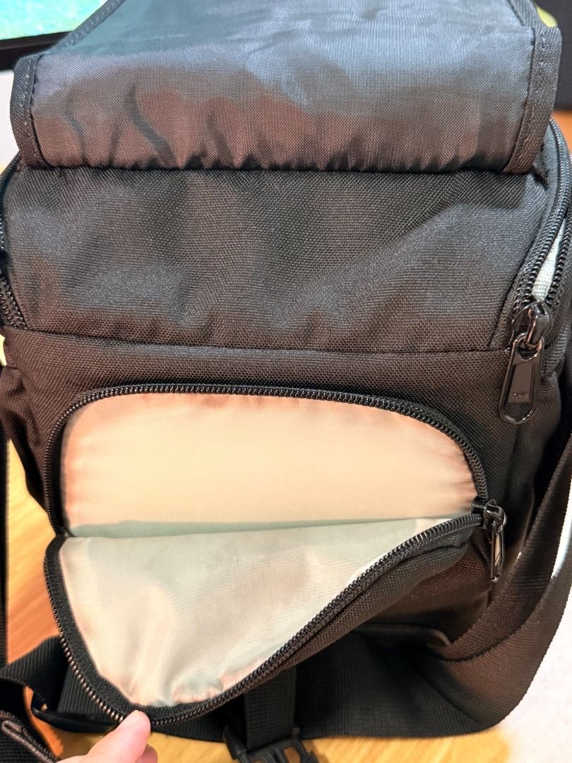 Lowepro Camera Bag (Category: Camera Bags & Carriers) located in Taguig. Submitted by bravecloud_beb7a5 (Listing ID 1457079629, Image 2). Description: Product Details: Brand: Lowepro (Authentic) Model: Adventura SH 120 II Color: Black Capacity: Fits a compact DSLR with kit lens, small accessories, and personal items Features: Durable molded base to protect gear from moisture and impact, padded main compartment, adjustable/removable shoulder strap