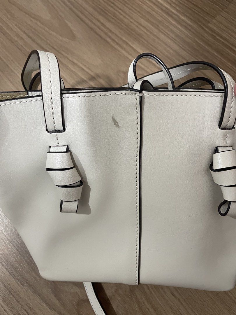 Massimo Dutti White Leather Tote Bag with Knotted Handles (Category: Tote Bags) located in Quezon City. Submitted by cm_preloved (Listing ID 1456987766, Image 3). Description: - White leather micro bag - Brand: Massimo Dutti - Knotted details on handles - With crossbody strap - Suede-like interior lining - Interior pocket - Small mark on front (visible in last photo) Retails for around 8k .