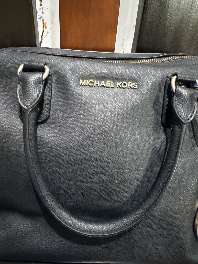 Michael Kors Black Leather Satchel Bag (Category: Luxury Bags & Wallets) located in San Juan, Ilocos Sur. Submitted by mklover10 (Listing ID 1456374694, Image 3). Description: - Authentic Michael Kors black leather satchel bag - Features iconic MK logo charm - Comfortable top handles - Secure zip closure - Ample interior space for essentials - Versatile for everyday wear or evening events.