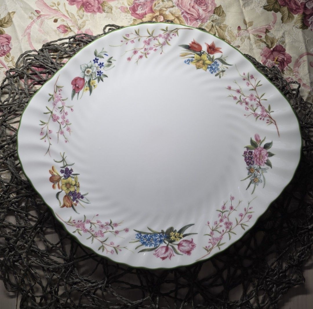 Minton Spring Blossom 10.5' Cake Serving Plate (Category: Other Kitchenware & Tableware) located in Zamboanga. Submitted by lunavinum (Listing ID 1456967259, Image 2). Description: - Minton Spring Blossom Cake Serving Plate -Approx meas: 10.5 inches - Condition: light stacking mark and two tiny paint chips, please see images, barely visible. - Beautiful vintage plate with floral swirl design - Delicate flowers and branches around the rim - Lovely