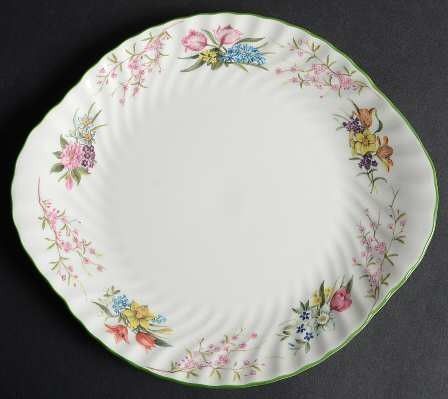 Minton Spring Blossom 10.5' Cake Serving Plate (Category: Other Kitchenware & Tableware) located in Zamboanga. Submitted by lunavinum (Listing ID 1456967259, Image 1). Description: - Minton Spring Blossom Cake Serving Plate -Approx meas: 10.5 inches - Condition: light stacking mark and two tiny paint chips, please see images, barely visible. - Beautiful vintage plate with floral swirl design - Delicate flowers and branches around the rim - Lovely