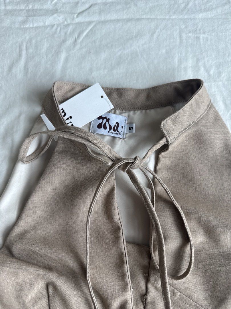 Miu the Label Sol Top Brand New (Category: Sleeveless) located in Taguig. Submitted by celaenaaa (Listing ID 1457123667, Image 2). Description: Miu the Label Sol Top Light Brown Color Brand New Size small No issues, with tag! RFS: Too small on me 🥲 Loc: Legaspi, Makati Tags: zara carino cariño araw the line phia the label isa the label.