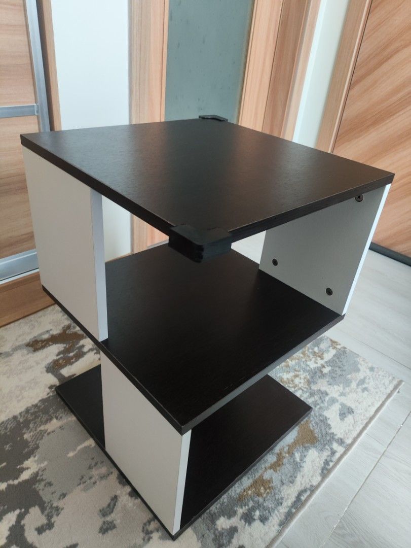 Modern 2-Tier Side Table - Black and White (Category: Tables & Sets) located in Quezon City. Submitted by solid_kicks (Listing ID 1457052370, Image 2). Description: Rush for sale>> - Stylish 2-tier side table - Unique, modern design - Black top and bottom shelves - White supports - Ideal for living rooms or bedrooms - Compact size fits most spaces RFS: Moved in to a smaller space. No space for the table. Bought January for 1500 at SM North .