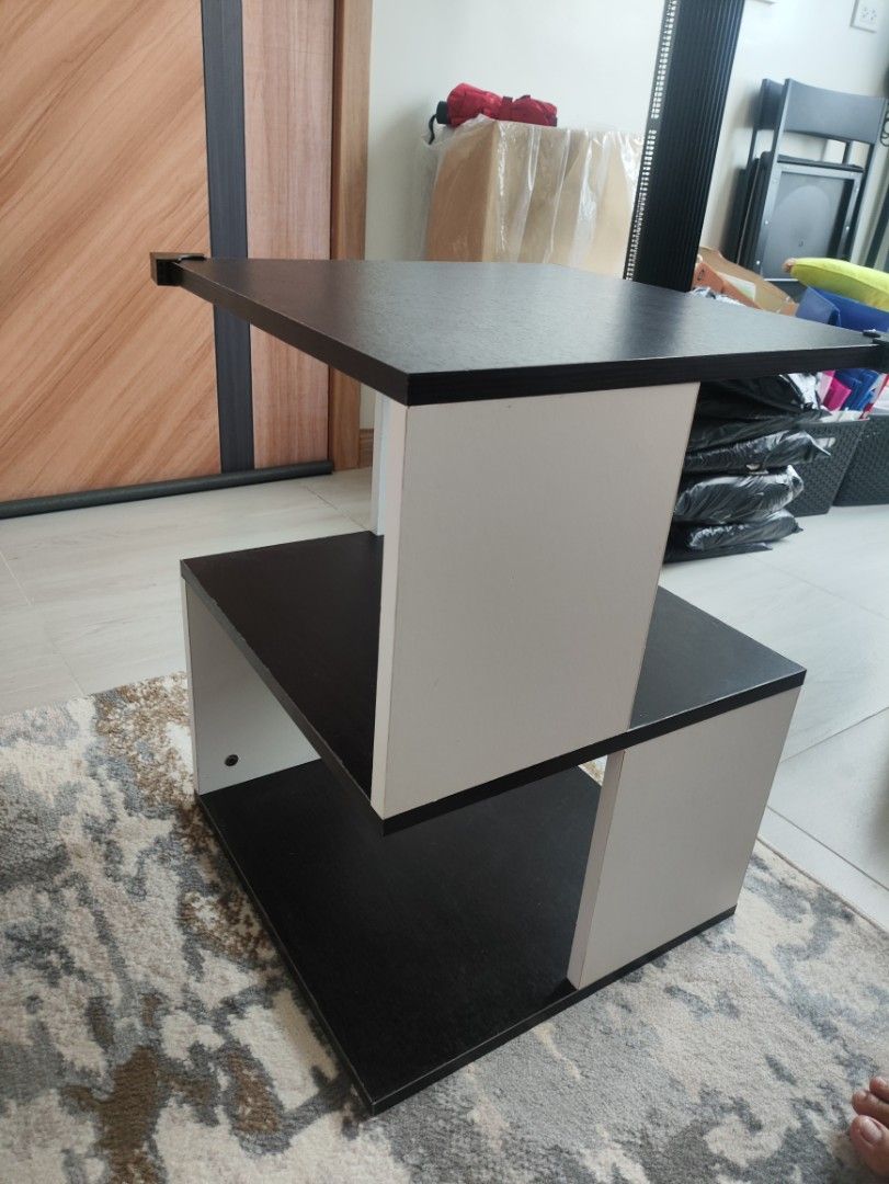 Modern 2-Tier Side Table - Black and White (Category: Tables & Sets) located in Quezon City. Submitted by solid_kicks (Listing ID 1457052370, Image 1). Description: Rush for sale>> - Stylish 2-tier side table - Unique, modern design - Black top and bottom shelves - White supports - Ideal for living rooms or bedrooms - Compact size fits most spaces RFS: Moved in to a smaller space. No space for the table. Bought January for 1500 at SM North .