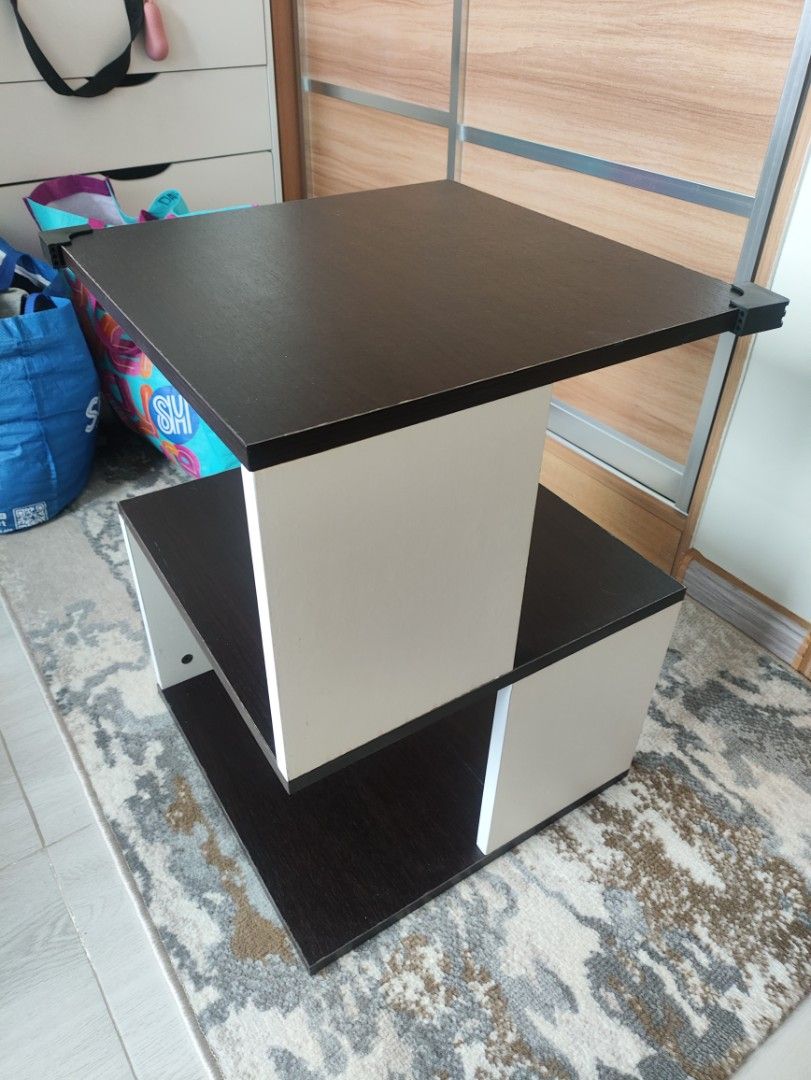 Modern 2-Tier Side Table - Black and White (Category: Tables & Sets) located in Quezon City. Submitted by solid_kicks (Listing ID 1457052370, Image 3). Description: Rush for sale>> - Stylish 2-tier side table - Unique, modern design - Black top and bottom shelves - White supports - Ideal for living rooms or bedrooms - Compact size fits most spaces RFS: Moved in to a smaller space. No space for the table. Bought January for 1500 at SM North .