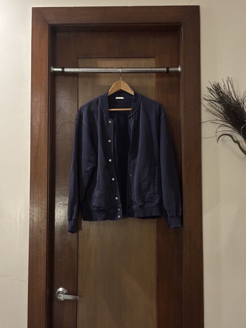 Navy Blue Bomber Jacket (Category: Coats, Jackets and Outerwear) located in Marikina City. Submitted by satzumma (Listing ID 1457067615, Image 1). Description: - Navy blue bomber jacket - Button-up front - Ribbed cuffs and hem - Comfortable and casual - Great for layering.