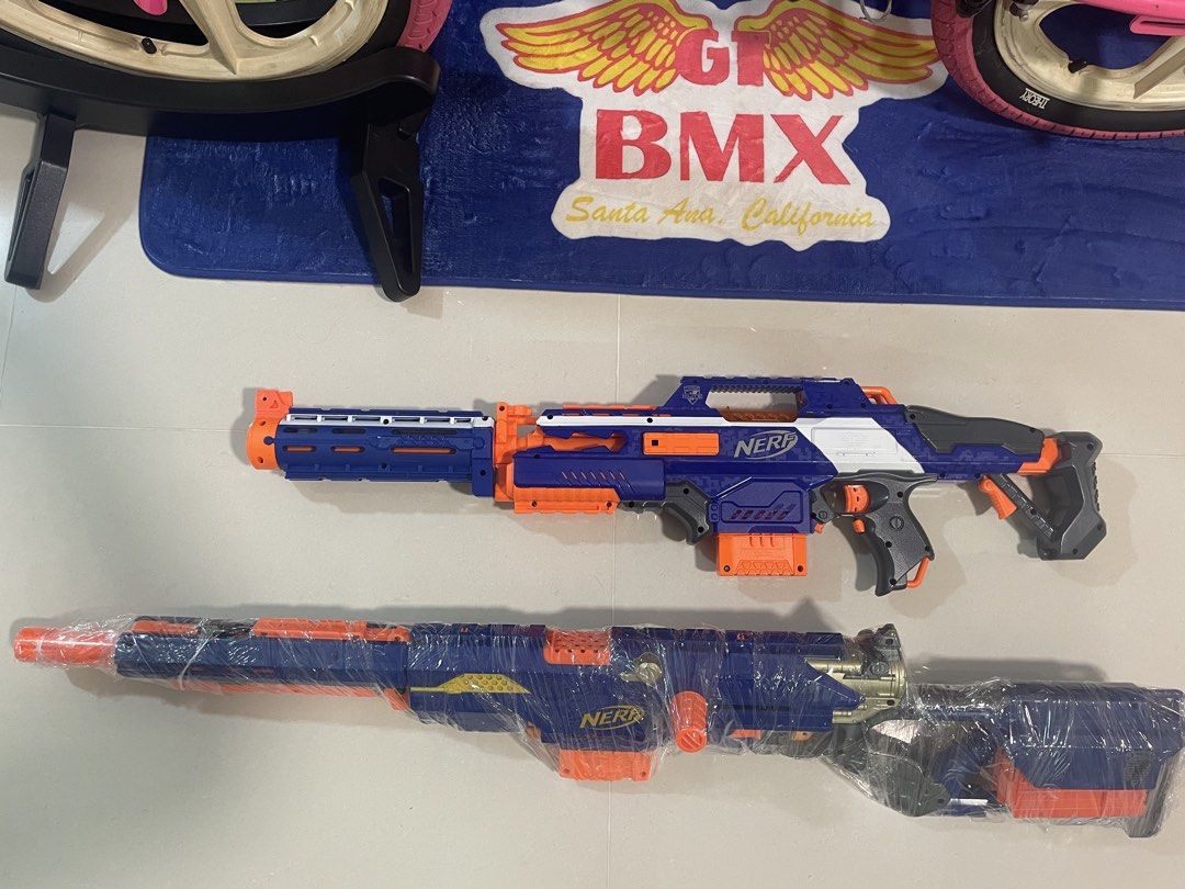 Nerf assorted (Category: Action & Battle Toys) located in Singapore. Submitted by soulofvintage (Listing ID 1457020802, Image 1). Description: Both working condition Battery tray all good Long strike have some paint mark But all work fine.