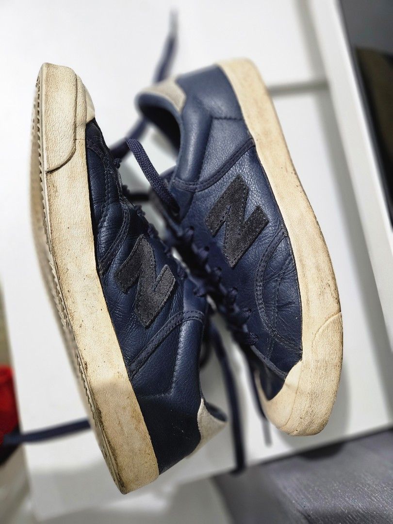 OG New Balance Pro Court Low (Category: Casual Shoes) located in Pasay City. Submitted by pass.it.on.ph (Listing ID 1457129006, Image 3). Description: Model: New Balance Pro Court Low ​Style/Model Code: PROCTSOC (Manufacturing Date: 07/2017) ​Size: US 7.5 / UK 7 / EU 40.5 / 25.5 CM ​Width: D (Standard Men's Width) ​Materials: Navy blue pebbled leather upper, suede logo/heel patch, and a textured rubber cupsole. ​Upper Leather: The navy blue leath