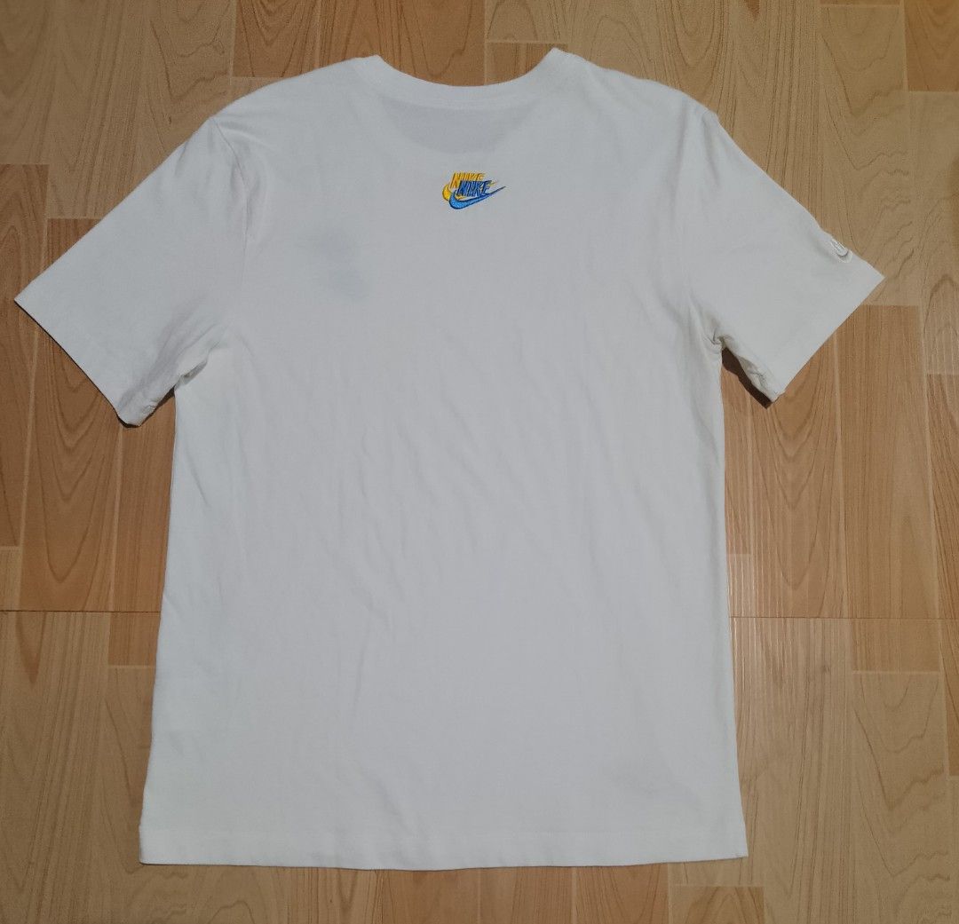 Nike White T-Shirt with Multiple Embroidered Logos (Category: Tshirts & Polo Shirts ) located in San Jose del Monte. Submitted by azetor (Listing ID 1457040191, Image 3). Description: - Classic white Nike t-shirt - Features embroidered Nike logos on front and back - Small red Nike logo detail on bottom left hem - Made from soft, comfortable cotton material - Ideal for everyday casual wear - size medium on tags - measurements - chest 19 - length 2