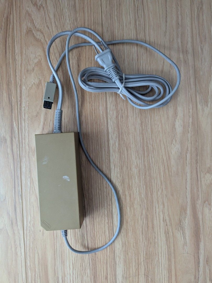Nintendo Wii Console with AC Adapter and Sensor Bar (Category: Nintendo) located in Makati City. Submitted by marielr (Listing ID 1457063003, Image 3). Description: - White Nintendo Wii console - Includes AC adapter (USA input) - Includes sensor bar - Everything you need to get started .