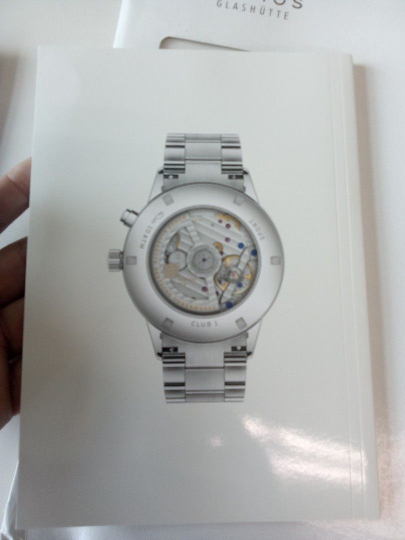 NOMOS Glashütte "The Collection" Watch Catalog (Category: Men's Watches) located in Pasig City. Submitted by teebeedeee (Listing ID 1457138314, Image 3). Description: - NOMOS Glashütte 'The Collection' catalog - Features popular models like Tangente, Ahoi, Metro, and others - Includes detailed information on watch calibers and manufacturing processes - An excellent reference for watch enthusiasts and collectors - Visit nomos-glashuette.com for a 