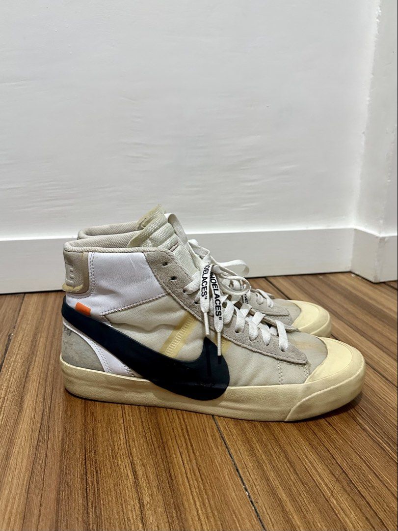 Off-White x Nike Blazer Mid "All Hallows Eve" (Category: Sneakers) located in Caloocan City. Submitted by peejay.dee (Listing ID 1457127792, Image 2). Description: - Off-White x Nike Blazer Mid sneakers - Color: White and beige - Signature Off-White details: - “SHOELACES” text on laces - Off-White text on the side - A highly sought-after collaboration, perfect for collectors and sneakerheads! - Black Nike swoosh - Beige sole - Authenticity: 100% 