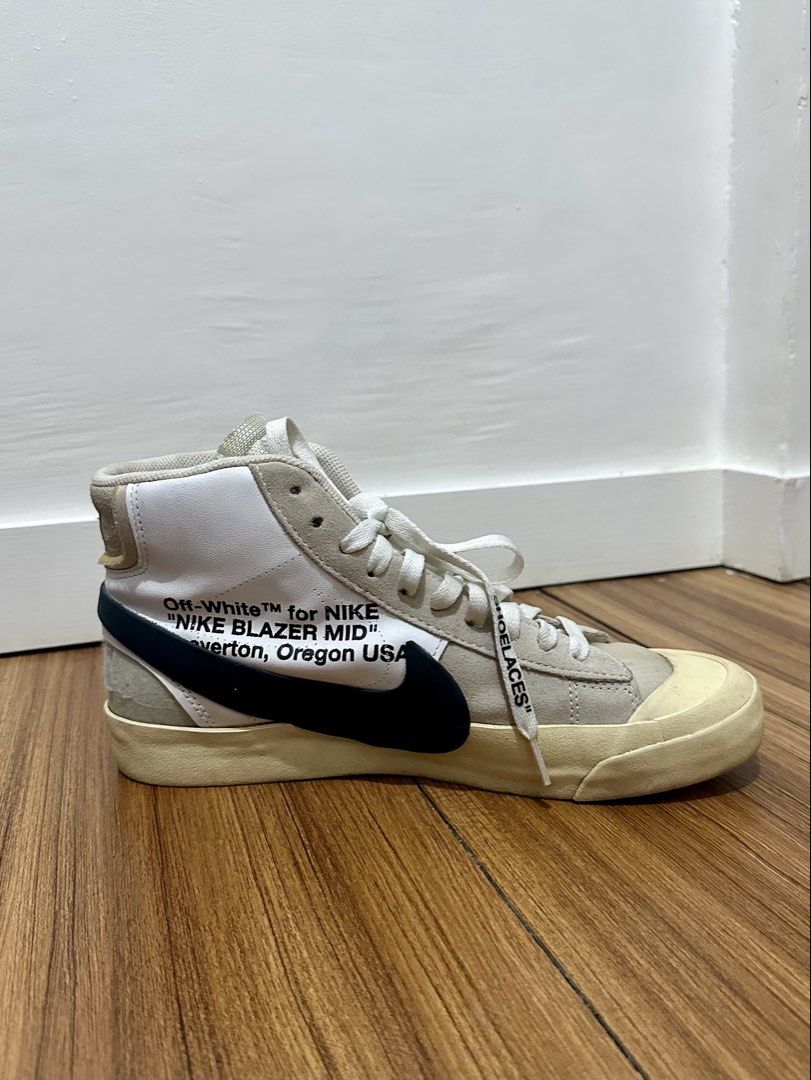 Off-White x Nike Blazer Mid "All Hallows Eve" (Category: Sneakers) located in Caloocan City. Submitted by peejay.dee (Listing ID 1457127792, Image 3). Description: - Off-White x Nike Blazer Mid sneakers - Color: White and beige - Signature Off-White details: - “SHOELACES” text on laces - Off-White text on the side - A highly sought-after collaboration, perfect for collectors and sneakerheads! - Black Nike swoosh - Beige sole - Authenticity: 100% 