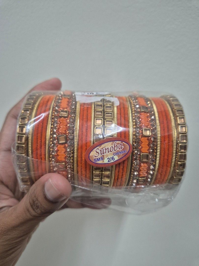 Orange Bangles (Category: Bracelets) located in Petaling Jaya. Submitted by radicallypreloved (Listing ID 1456959079, Image 1). Description: - Set of orange bangles - Gold and rhinestone accents - Brand: Sunoba - Size: 2.6 PICKUP AT OLD KLANG ROAD,KL. CAN ARRANGE LALAMOVE TOO. NO JOY BUYER PLS. - Suitable for parties or everyday wear - Comes in original packaging.