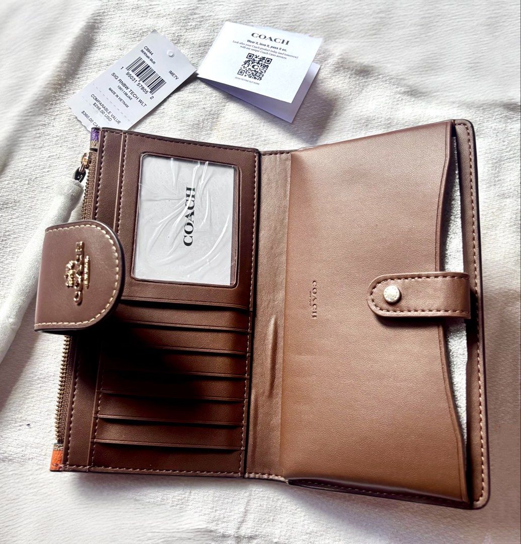 ORIGINAL & IMPORTED Signature Rainbow TechWallet (Category: Wallets & Card holders) located in Malolos. Submitted by cheerz21 (Listing ID 1456989193, Image 2). Description: ORIGINAL & IMPORTED Signature Rainbow TechWallet -Signature Rainbow TechWallet -Brand new w/ issue 📌ISSUE: ngkaron lang po ng leather bubbles inside the wallet due to shipping (pls swipe photo for deets) -With tag and care card -Exact photos are posted No return, no exchange.