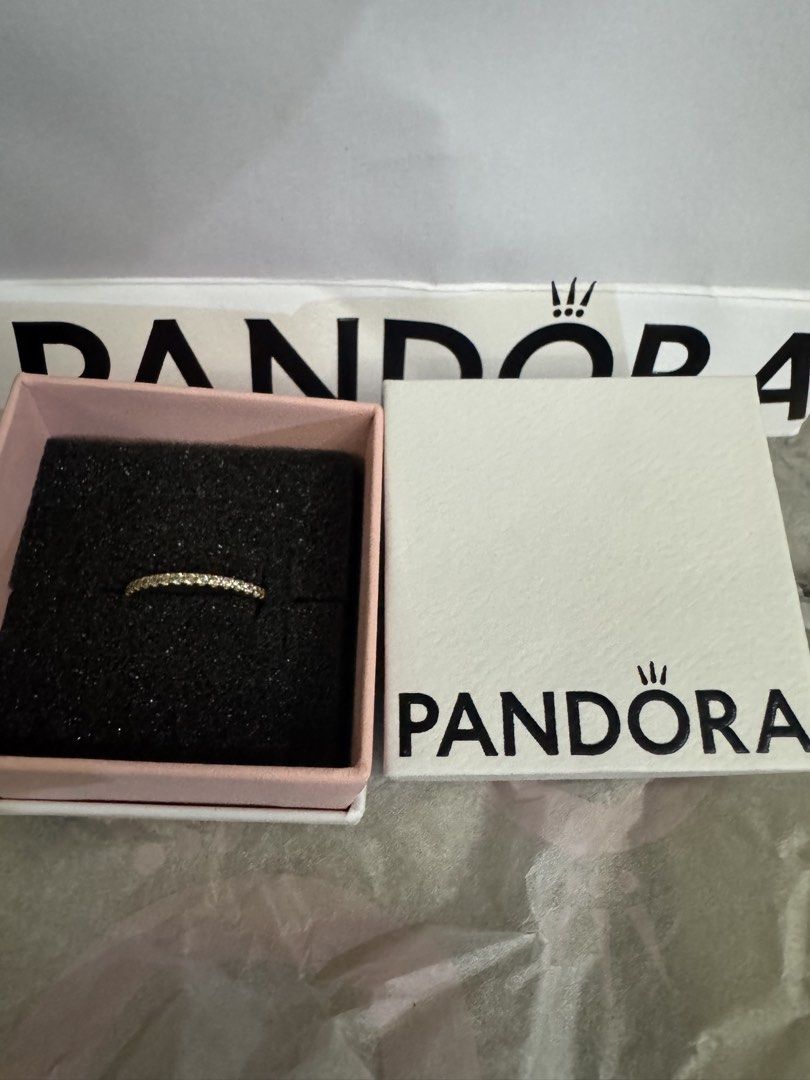 PANDORA GOLD RING (Category: Rings) located in Manila. Submitted by matchaonly (Listing ID 1457045291, Image 2). Description: brought September 2025 (have warranty) Original price: 4,550 Size: 5 or 6 (sorry not sure) WITH RECEIPT FROM GREENBELT 5 - Pandora Sparkling Band Ring - Features a gold band with sparkling stones - Comes with original Pandora box and packaging - Product code: 162999C01-52 Loc: San Miguel, Bulacan / Manila / Pasay.