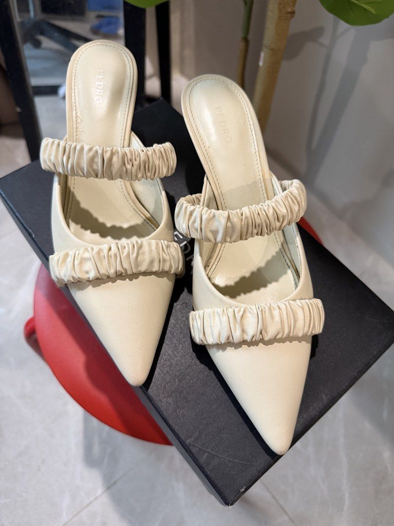 PEDRO Cream Ruched Pointed Toe Mules Heels (Category: Heels) located in Caloocan City. Submitted by hellomaryon (Listing ID 1457015887, Image 3). Description: Authentic PEDRO pointed-toe slip-on mules in a versatile cream / chalk white color. Features a soft ruched / scrunchie-style vamp strap that adds an elegant, modern accent to any look. ✨ Comes with original PEDRO shoebox pictured ✨ Great for work, casual chic outfits, brunch, or minimalist 