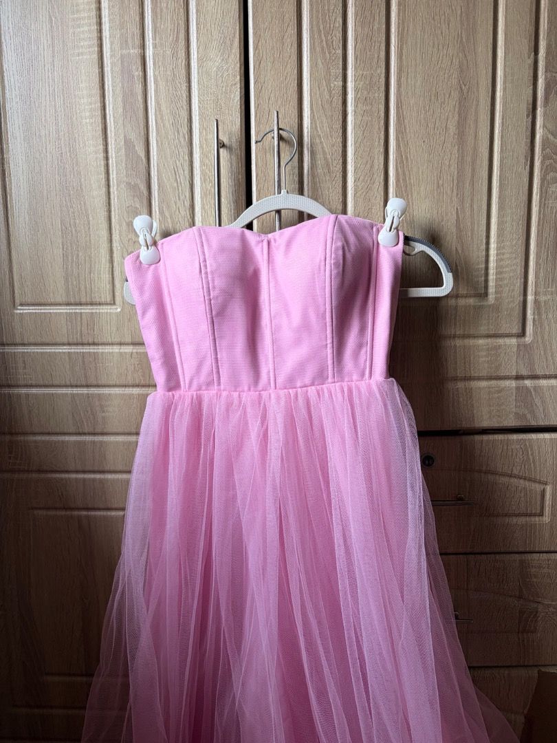 PINK CORSET TULLE MULTI-WAY DRESS (Category: Dresses) located in Tanza. Submitted by kmoarse (Listing ID 1456970485, Image 3). Description: - Pink corset tulle dress - Versatile for wedding or formal occasions - Easily pairs with heels - With 4 mesh sleeves - Used once.