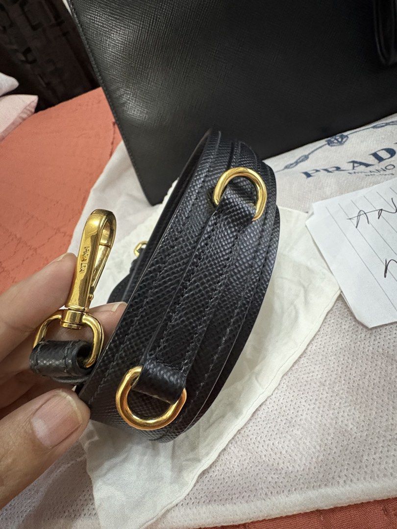 Prada Borsa Saffiano Cuir + City Nero (Category: Shoulder Bags) located in Marikina City. Submitted by anna.marcelino4582 (Listing ID 1457007654, Image 2). Description: FS: Prada Borsa Saffiano Cuir + City Nero 📍Color: Black 📍Gold Hardware 📍Inclusion: Strap, Cards, Receipt, Dustbag 📍Dimensions: Length: 31 cm / 12.5” Height: 22cm / 9” Depth: 12cm / 5” (approximate) (Medium Sized) 📍Rank A condition; VGUC 📍 Marikina area ₱40,000 only; slightly