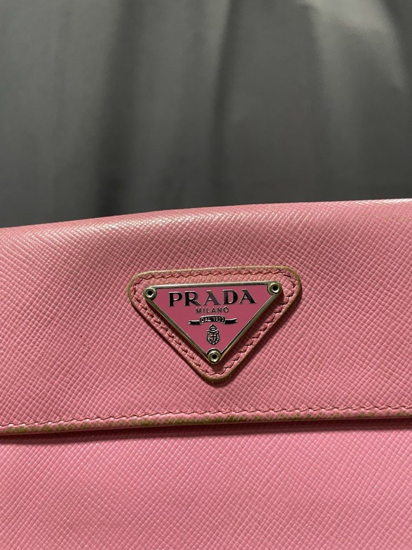 Prada Saffiano leather wallet pink (Category: Luxury Bags & Wallets) located in Davao. Submitted by lwky_thrift (Listing ID 1457132831, Image 2). Description: Prada Saffiano leather wallet pink Normal Sign of use only kindly check the attached photos Good Condition .