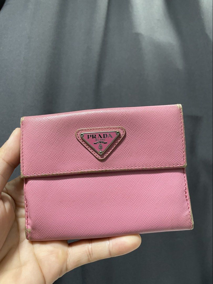 Prada Saffiano leather wallet pink (Category: Luxury Bags & Wallets) located in Davao. Submitted by lwky_thrift (Listing ID 1457132831, Image 1). Description: Prada Saffiano leather wallet pink Normal Sign of use only kindly check the attached photos Good Condition .