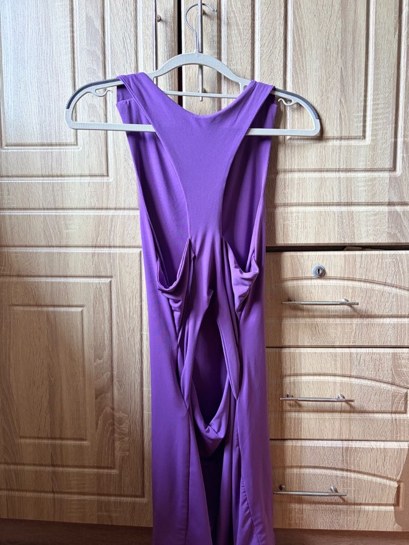 Purple Racerback Mini Dress with Open Back (Category: Dresses) located in Tanza. Submitted by kmoarse (Listing ID 1457082260, Image 2). Description: - Chic purple mini dress - Stylish racerback with an open back - Made from comfortable, stretchy fabric - Versatile for casual outings or special occasions - Pairs well with sandals or heels.