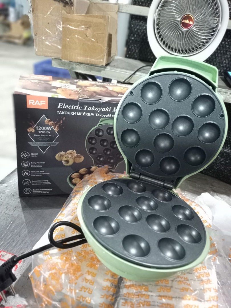 RAF Electric Takoyaki Maker 1200W (Category: Cookware & Accessories) located in Bulacan. Submitted by celinexxxbuyer (Listing ID 1457094814, Image 1). Description: - RAF Electric Takoyaki Maker - Powerful 1200W for quick cooking - Non-stick coating for effortless cleaning - Uniform heat distribution for perfectly cooked takoyaki - Double-sided heating ensures even cooking - Enjoy delicious homemade takoyaki - Perfect for snacks and parties.