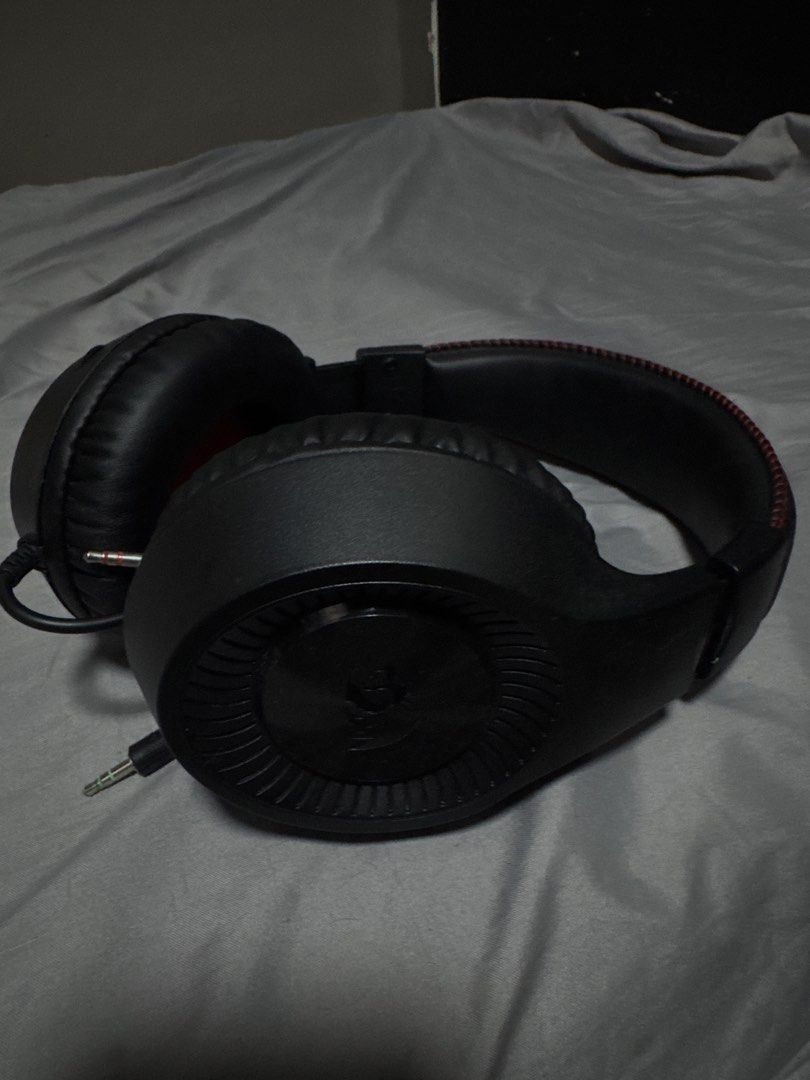 Redragon Gaming Headset with Microphone (Category: Headphones & Headsets) located in Las Pinas. Submitted by y0sh1ee (Listing ID 1456968289, Image 3). Description: - Redragon Gaming Headset - Color: Black with red stitching detail - Built-in microphone - Dual 3.5mm jack connectors - Ideal for gaming and general audio use - Neat, coiled cable - Ready for a new owner -No issues -Like new.