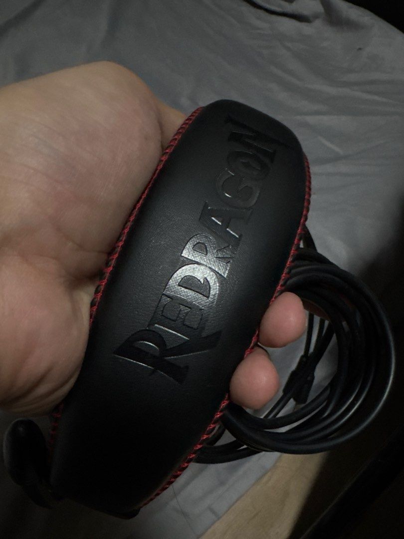 Redragon Gaming Headset with Microphone (Category: Headphones & Headsets) located in Las Pinas. Submitted by y0sh1ee (Listing ID 1456968289, Image 1). Description: - Redragon Gaming Headset - Color: Black with red stitching detail - Built-in microphone - Dual 3.5mm jack connectors - Ideal for gaming and general audio use - Neat, coiled cable - Ready for a new owner -No issues -Like new.