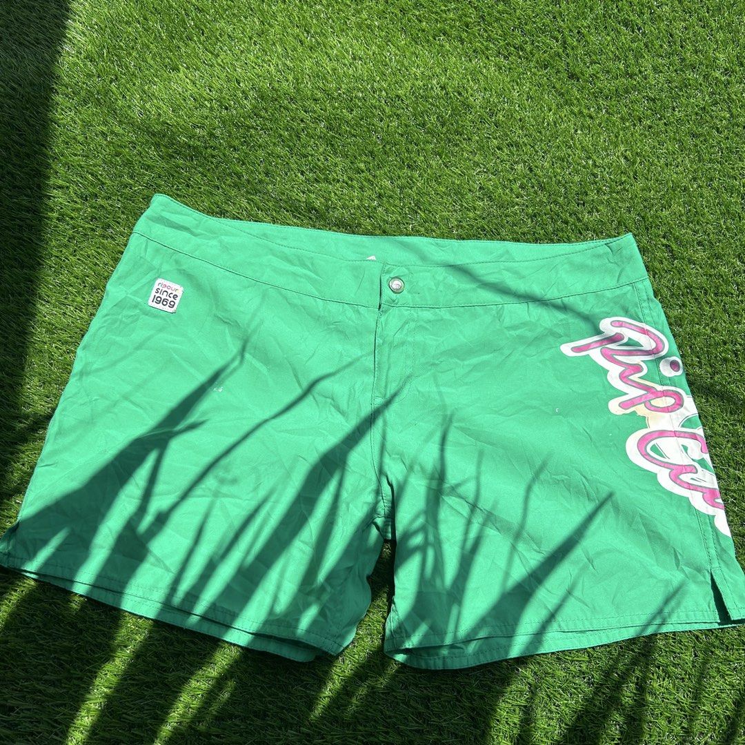 Rip Curl Green Board Shorts Since 1969 (Category: Shorts) located in Talisay. Submitted by sdnyrosee (Listing ID 1457000596, Image 1). Description: - Green Rip Curl board shorts - "Rip Curl" graphic on the side - "Rip Curl since 1969" patch on front left - Elastic waistband with drawstring - Side slit leg openings - Minor marks on the front - Ideal for beach or pool activities Vintage Rip Curl Bright Green Boardshorts 💚 Issue is murag burnt ang 