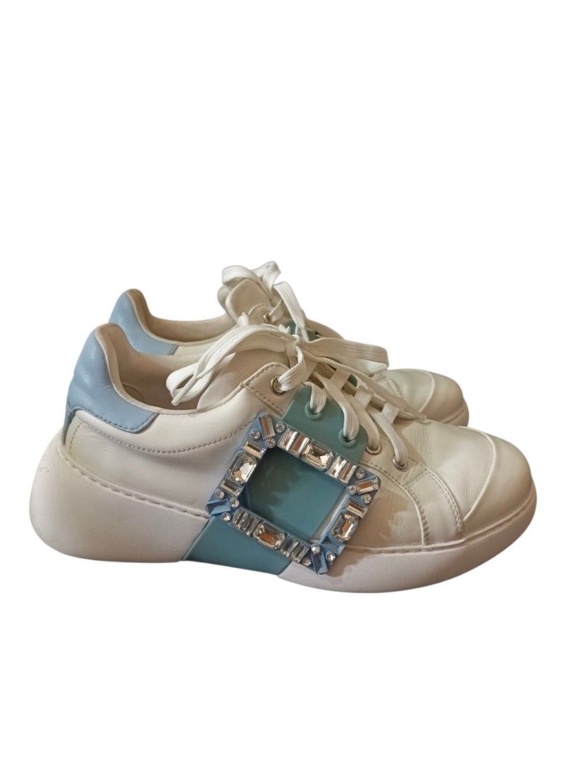 Roger Vivier "ViV" (Category: Sneakers & Footwear) located in Naga. Submitted by queburock (Listing ID 1456988937, Image 3). Description: - White leather sneakers with light blue accents - Features iconic "RV" buckle with crystals - Made in Italy - Women's size 38 - Adds a pop of luxury to casual outfits - "RV" logo embossed on the sole.