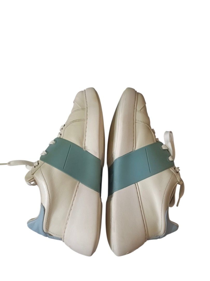 Roger Vivier "ViV" (Category: Sneakers & Footwear) located in Naga. Submitted by queburock (Listing ID 1456988937, Image 2). Description: - White leather sneakers with light blue accents - Features iconic "RV" buckle with crystals - Made in Italy - Women's size 38 - Adds a pop of luxury to casual outfits - "RV" logo embossed on the sole.