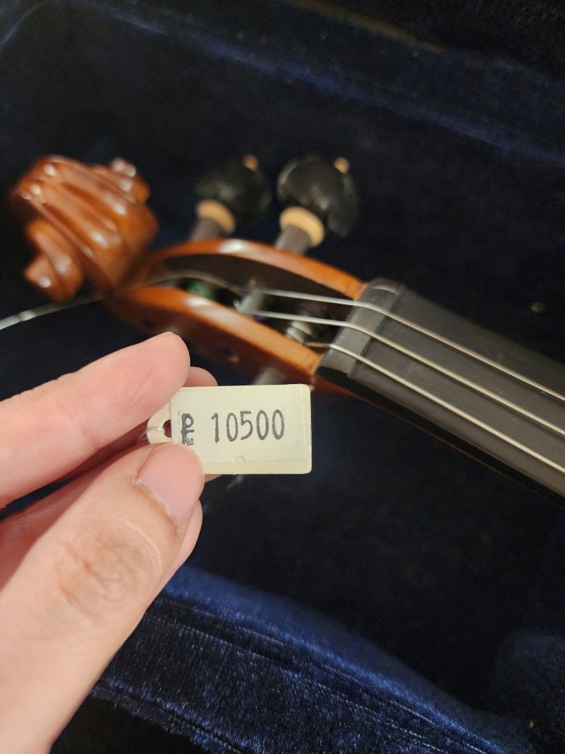 Rondo Strad Violin 4/4 Case and Bow (Category: Musical Instruments) located in Cainta. Submitted by theimpulsivecrafterph (Listing ID 1456963985, Image 3). Description: - Beautiful wood grain finish violin - Ideal for beginners or intermediate players - Comes with a protective case lined with plush blue velvet - Includes a bow for playing - Features 'Rondo Strap' tag - Bought originally for 10, 500, attempted lessons but realized violin is not fo