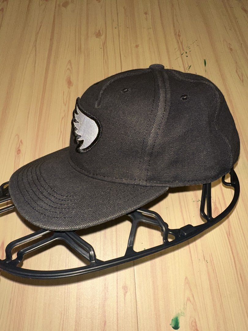 SAINT Black Baseball Cap with Wing Logo (Category: Caps & Hats) located in Quezon City. Submitted by mancave_stuff (Listing ID 1456971212, Image 3). Description: - Black baseball cap from SAINT - Features signature embroidered wing logo on the front - Inner lining with repeating SAINT logo pattern - Adjustable strap at the back for a customized fit - Ideal for everyday Moto wear.