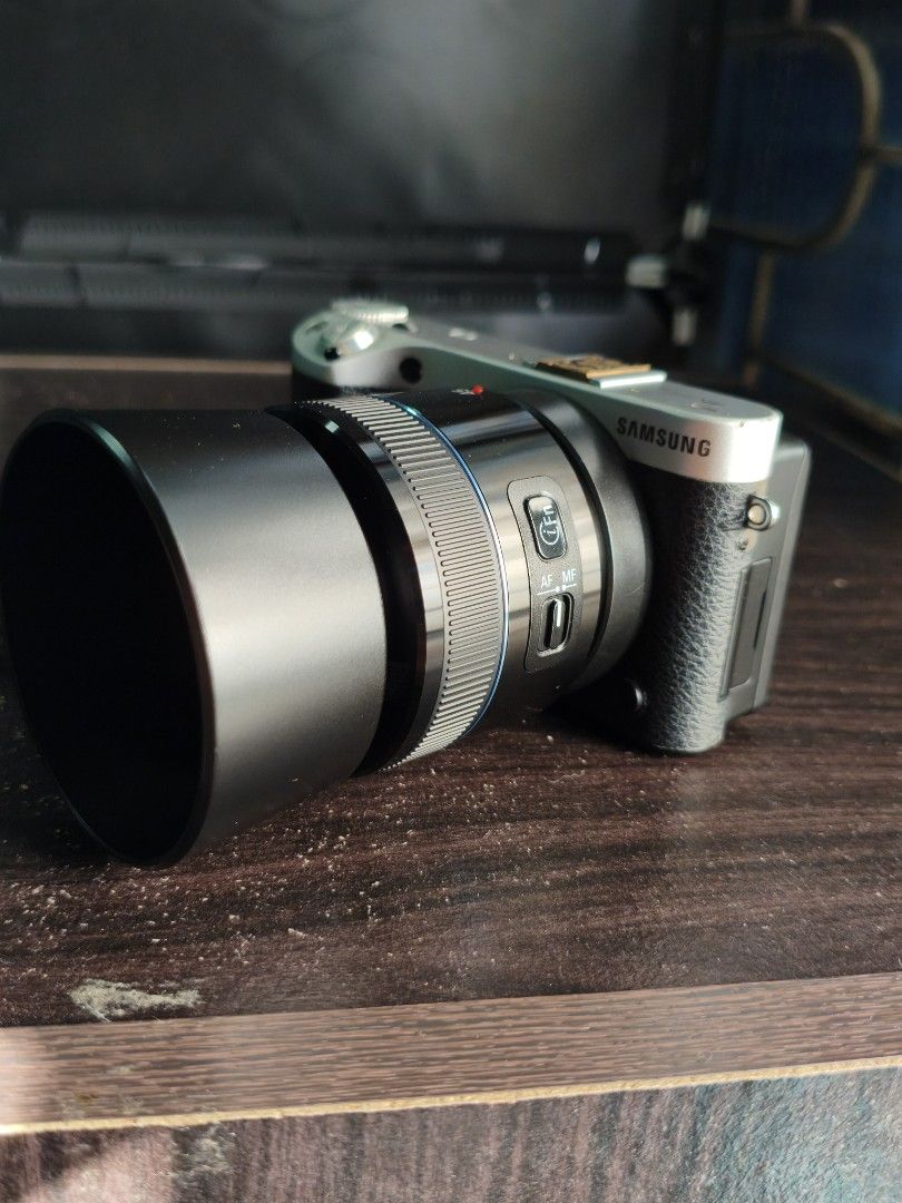 Samsung NX 500 Mirrorless Camera (Category: Cameras) located in Dagupan City. Submitted by jmszn (Listing ID 1457054257, Image 3). Description: Samsung NX 500 Mirrorless Camera - 28.2 MP BSI APS-C CMOS - With custom hotshoe cover - Flippable SUPER AMOLED screen - Issue: Leather wearing out, but does not affect performance. - Lens has small fungus but does not affect performance. PM for the picture. Inclusions: - 45mm F1.8 Prime Lens (worth ₱8k) -