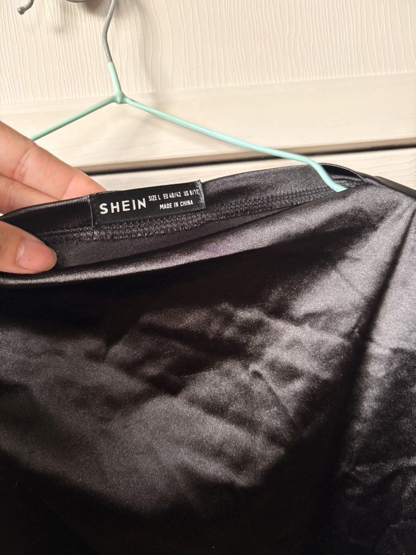 SHEIN Black Satin Cap Sleeve Bodysuit (Category: Others Tops) located in Makati City. Submitted by iu__00 (Listing ID 1457031670, Image 2). Description: - SHEIN Black Satin Bodysuit - Size: Large (L) - Features: Cap sleeves, thong bottom - Material: Smooth, shiny satin.