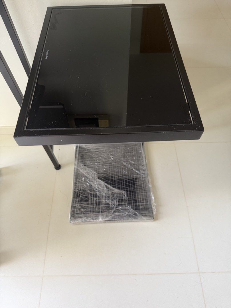 Side table (Category: Tables & Sets) located in Singapore. Submitted by goonduh (Listing ID 1456981531, Image 1). Description: NOT FROM IKEA. Solid temper glass! .