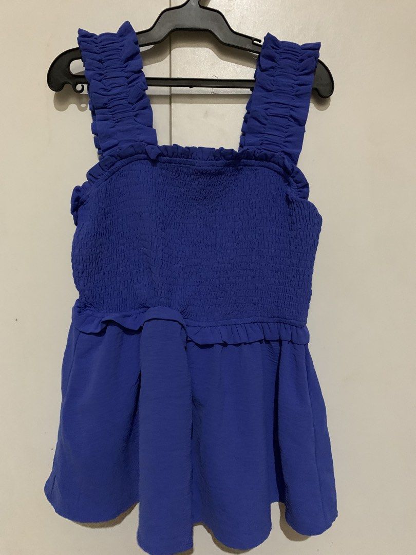 Smocked Ruffle Strap Peplum Top (Category: Sleeveless) located in Manila. Submitted by _wtfrn (Listing ID 1457086725, Image 1). Description: Selling my preloved but well loved clothes🎀 📌Blue flowy peplum hem top creating flattering silhouette feature 📌Size: S-M 📌Once used (no flaws) 📌Color may vary due to lightning 📍Quezon City 🛵Lalamove & Meet up nearby 💌: message me if your interested and will give you discounts🤗 .