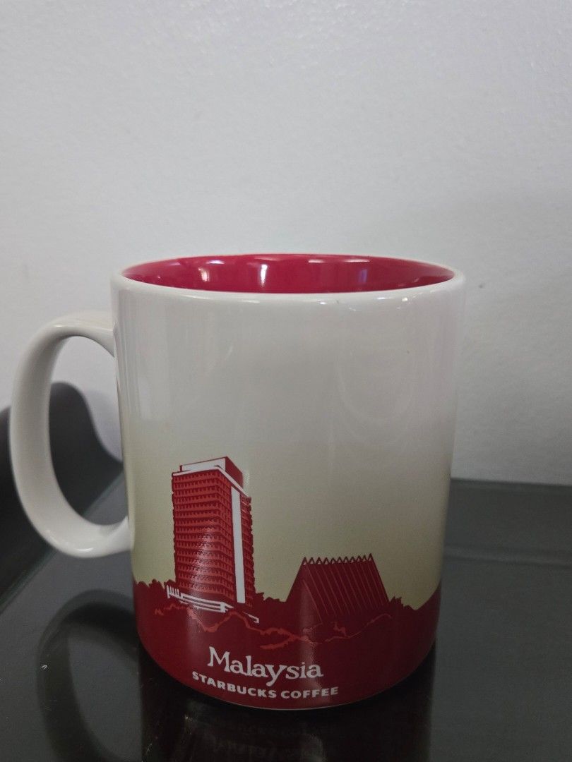 Starbucks Coffee Malaysia Mug 16oz (Category: Coffee & Tea Tableware) located in Quezon City. Submitted by samcas (Listing ID 1456964727, Image 2). Description: Starbucks Malaysia mug, 16oz. Features hibiscus and city skyline. Red interior. Stoneware, microwave/dishwasher safe..