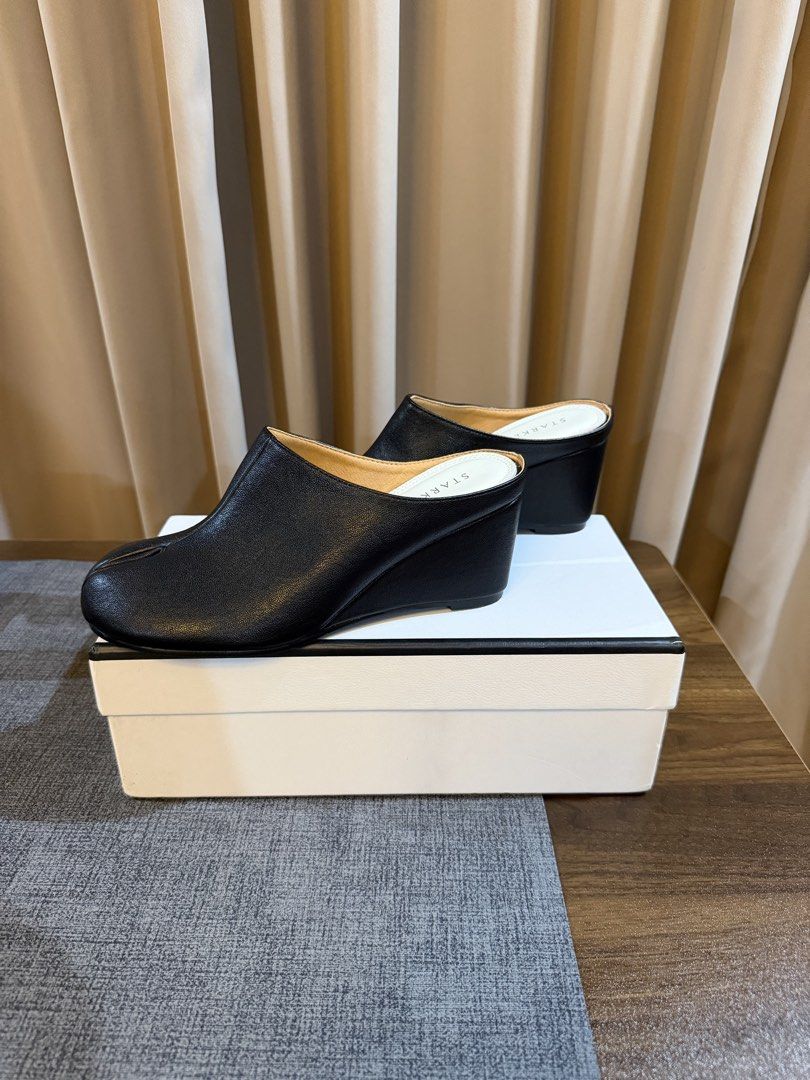 Tabi Wedge Mules / Clogs in Black Leather (Category: Wedges) located in Caloocan City. Submitted by hellomaryon (Listing ID 1457091036, Image 2). Description: Selling these Maison Margiela-inspired Tabi wedge mules in black leather. ✨ Condition: Brand new!! I just bought them from Taobao, but upon arrival, I realized they’re not quite my style. They come with the original box. I only opened the box to try them on, and they have never been used ou