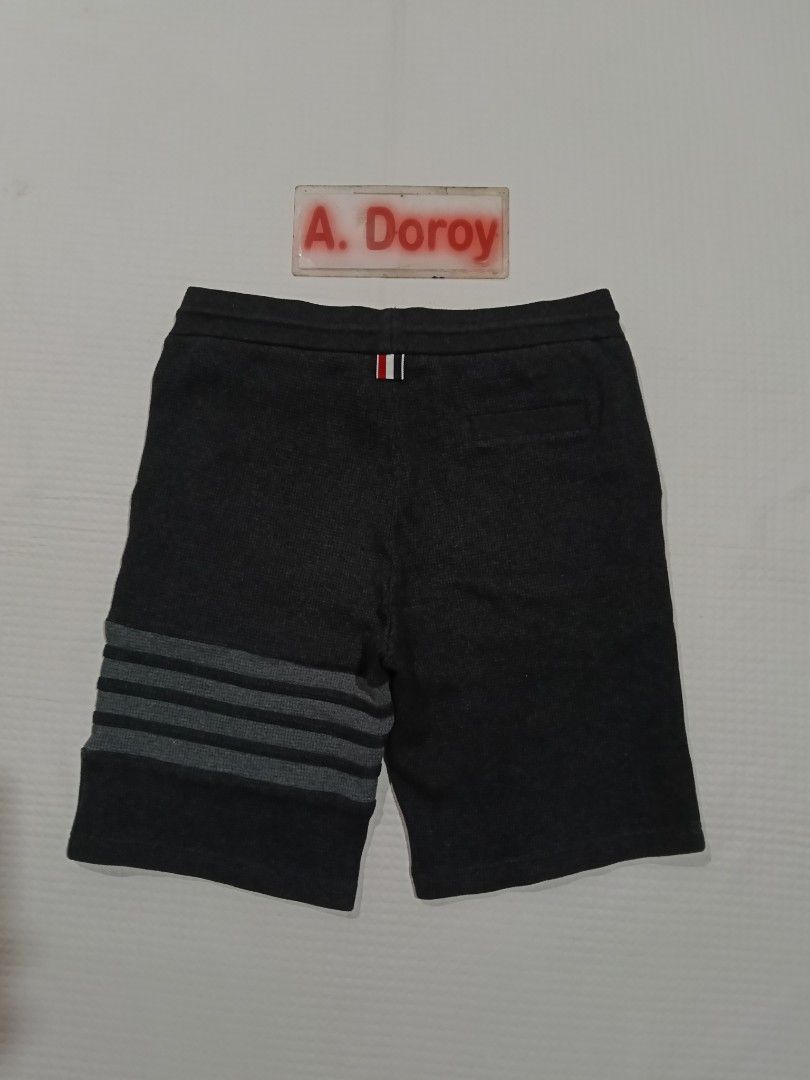 Thom Browne 4 bar Waffle Knit Cotton Short (Category: Luxury Apparel) located in Manila. Submitted by archie_doroy (Listing ID 1456976838, Image 2). Description: Thom Browne 4 bar Waffle Knit Cotton Short Dark Gray Color Size 3 on tag Best fit 32-34 waistline Length 20 inches Excellent Condition 💯 Color rate 9.8/10 Cloth rate 9.5/10 No any issues 1150 Freeship.