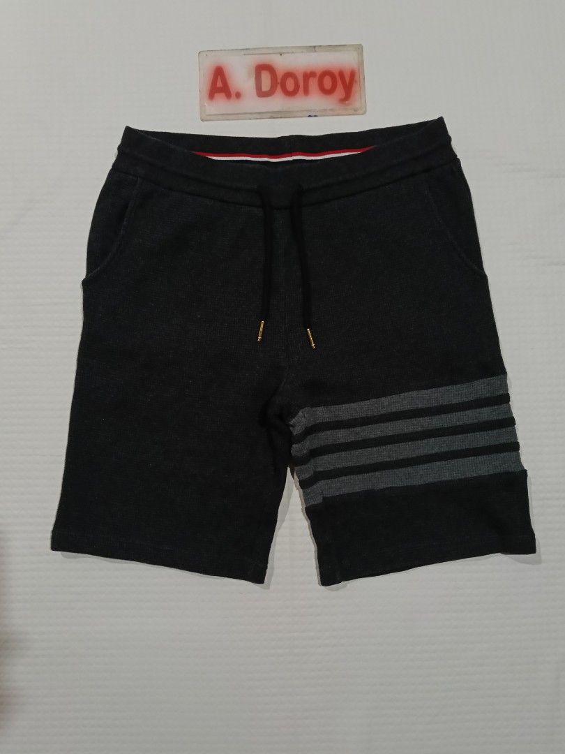 Thom Browne 4 bar Waffle Knit Cotton Short (Category: Luxury Apparel) located in Manila. Submitted by archie_doroy (Listing ID 1456976838, Image 1). Description: Thom Browne 4 bar Waffle Knit Cotton Short Dark Gray Color Size 3 on tag Best fit 32-34 waistline Length 20 inches Excellent Condition 💯 Color rate 9.8/10 Cloth rate 9.5/10 No any issues 1150 Freeship.