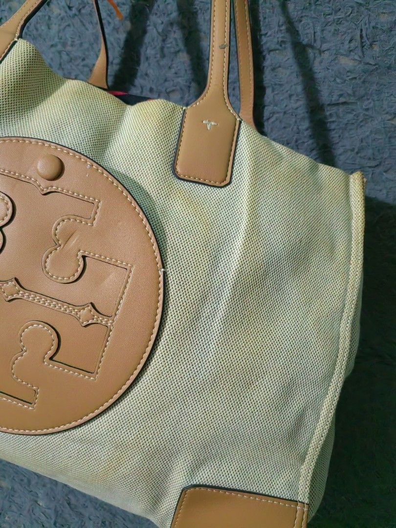 Tory Burch Canvas & Leather Tote Bag (Category: Luxury Bags & Wallets) located in Las Pinas. Submitted by huslerz (Listing ID 1456991367, Image 3). Description: - Classic Tory Burch tote bag - Beige canvas with tan leather trim - Iconic double T logo - Spacious interior, ideal for everyday or travel - Some signs of wear on canvas (as pictured) - Stylish and practical.